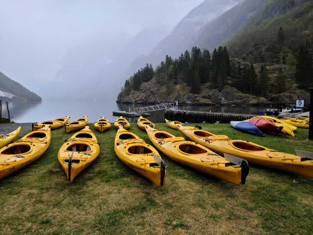 Kayaks on the shore of a Norwegian fjord