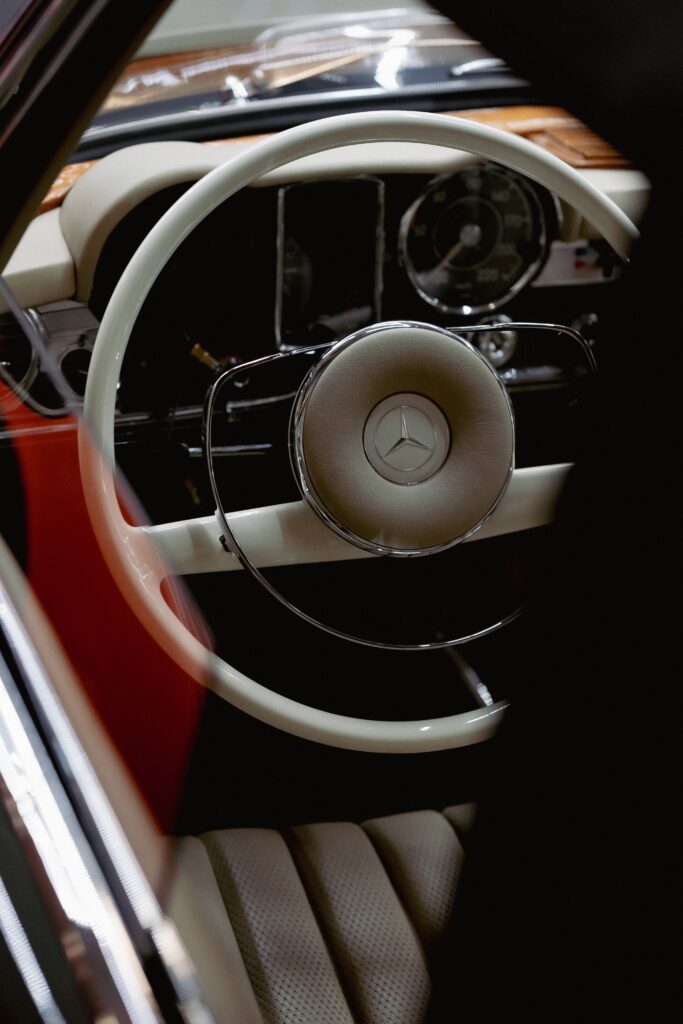Classic car steering wheel and dashboard detail Classic car steering wheel and dashboard detail